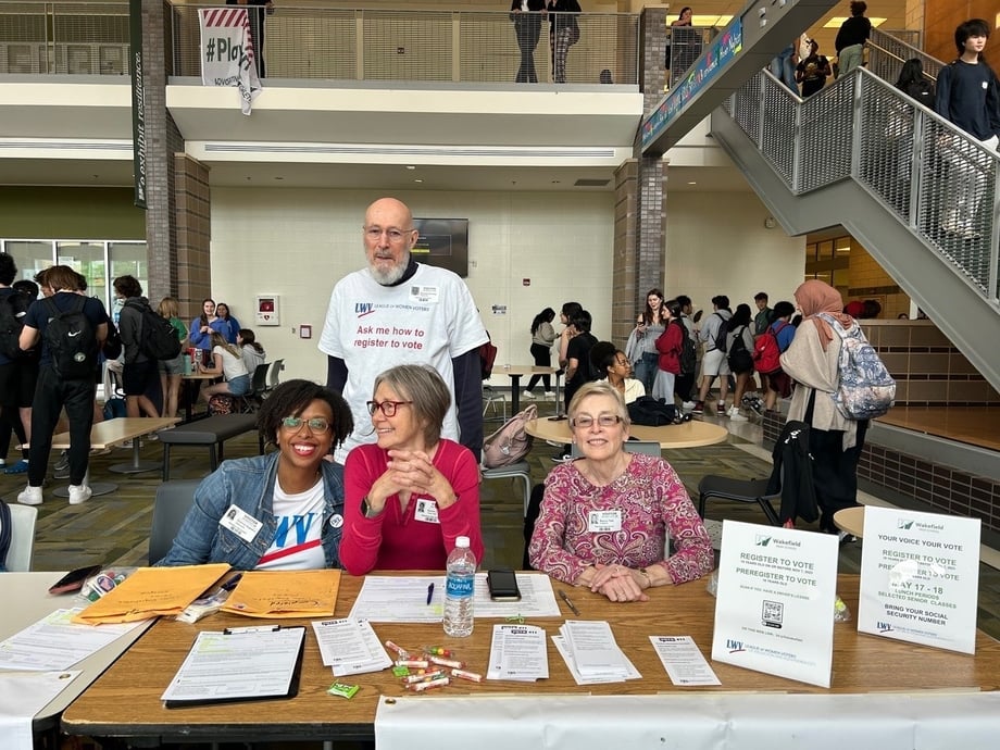 Shannon Augustus and other League members registering voters at a Virginia High School