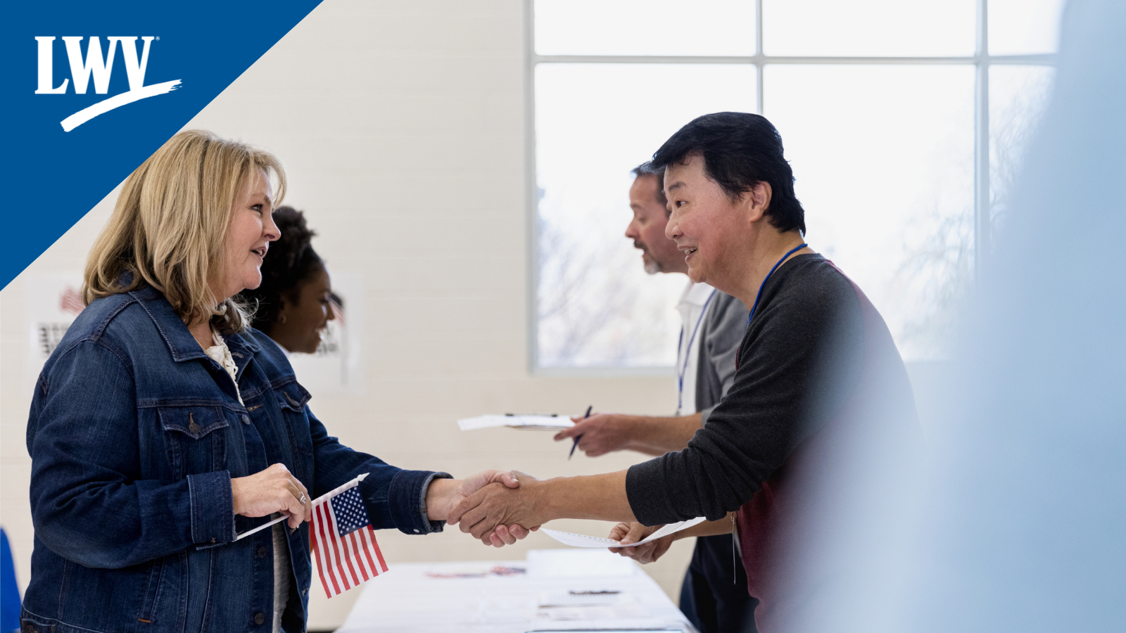 An election worker helping someone vote