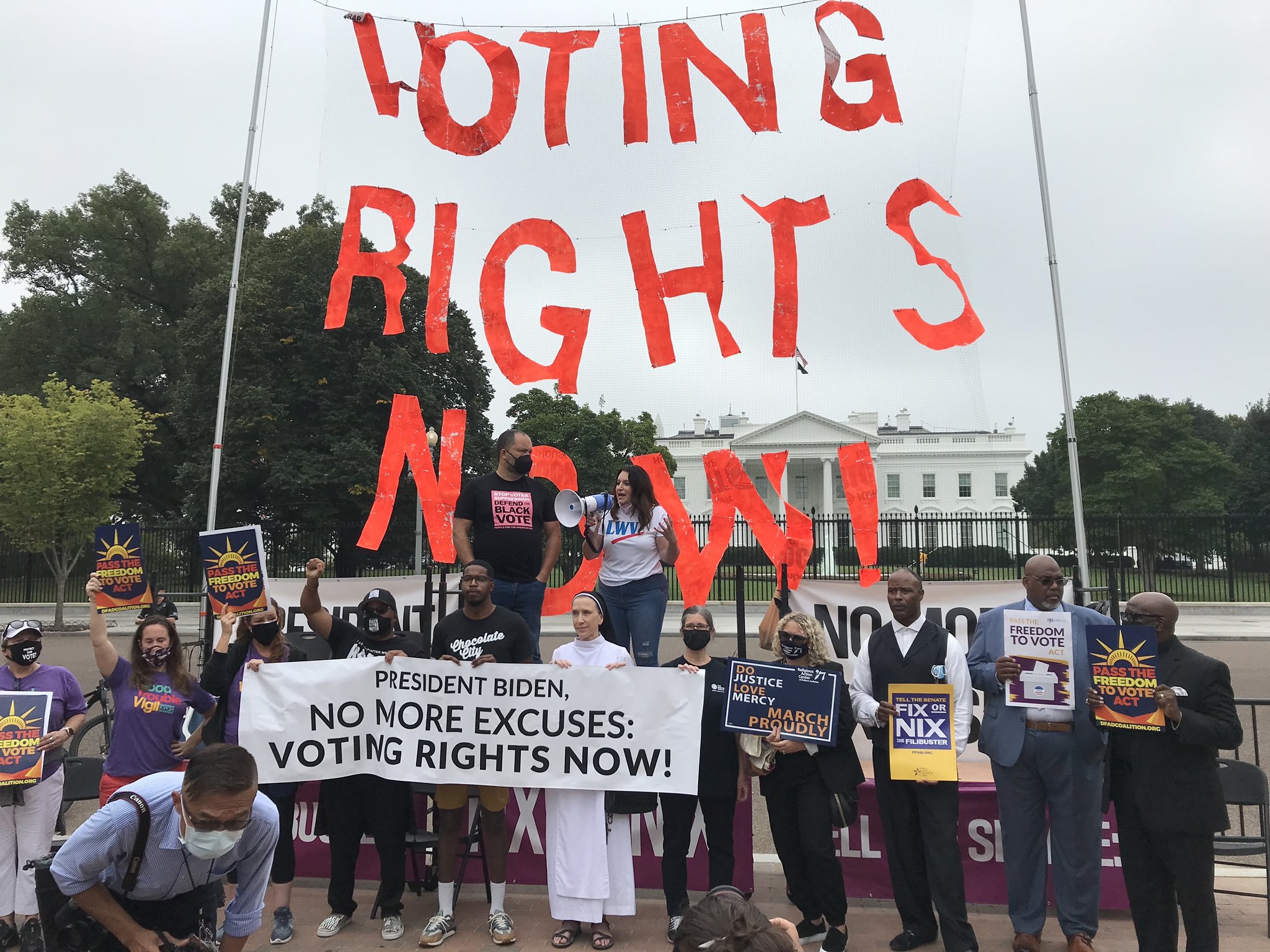 CEO Virginia Kase and fellow activists protesting in front of the White House