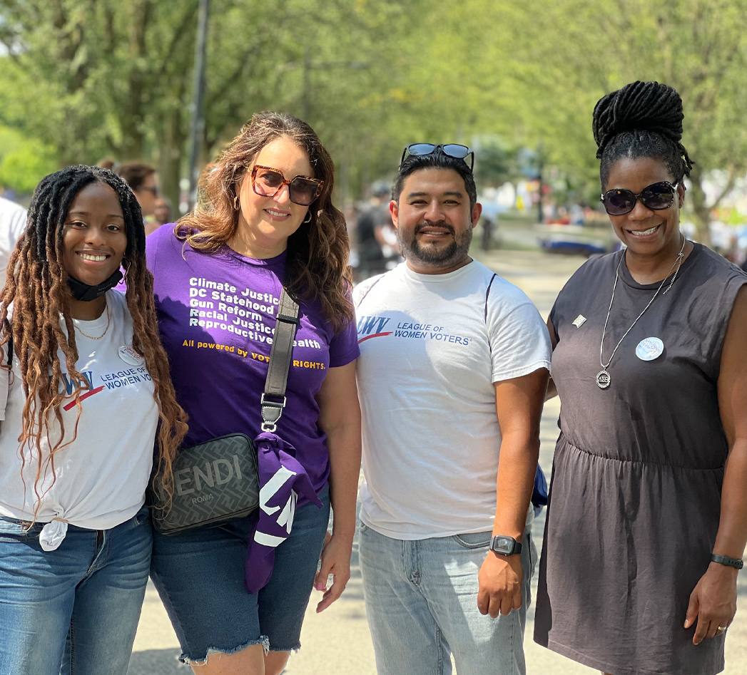 Four LWV members smiling to the camera