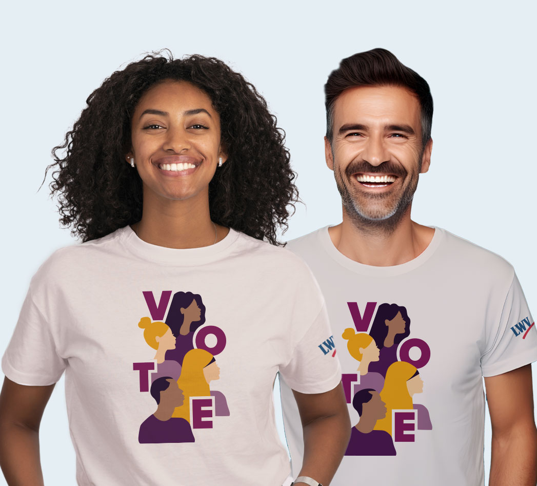 Two people wearing "VOTE" shirts