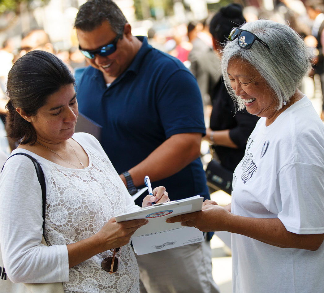 A LWV member registering another woman to vote