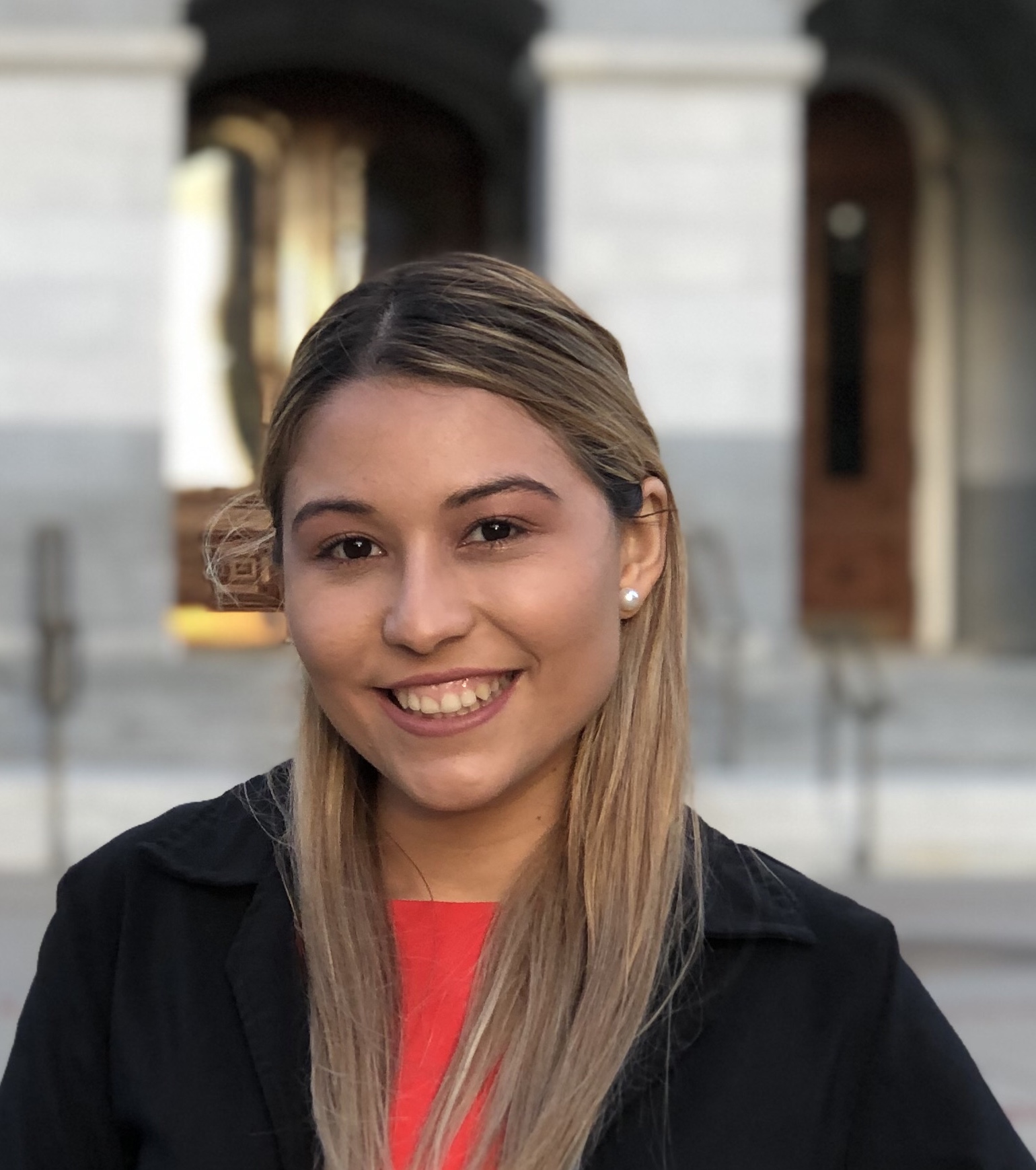 Woman in black jacket smiling