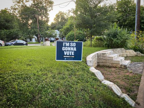A Texas lawn with a sign saying "I'm so gonna vote"