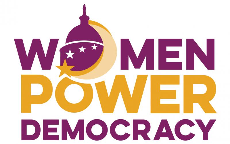 "Women Power Democracy," with the "o" in "women" shaped like the US Capitol