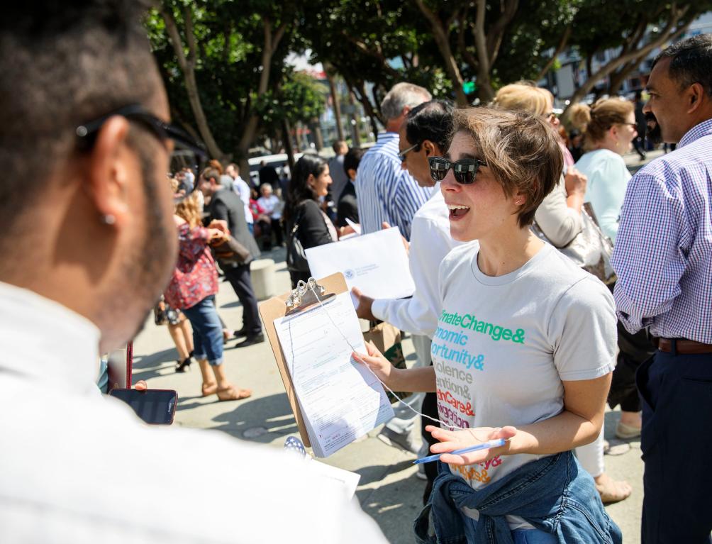 Woman getting signatures for climate action