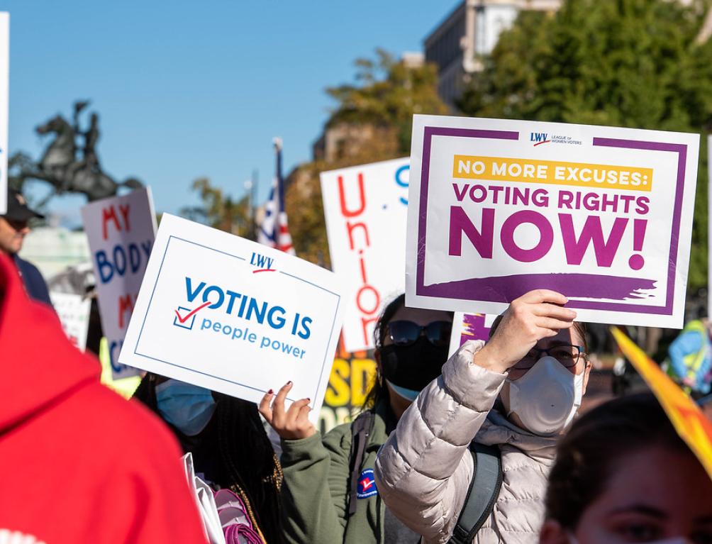 Signs that say "Voting Rights Now"