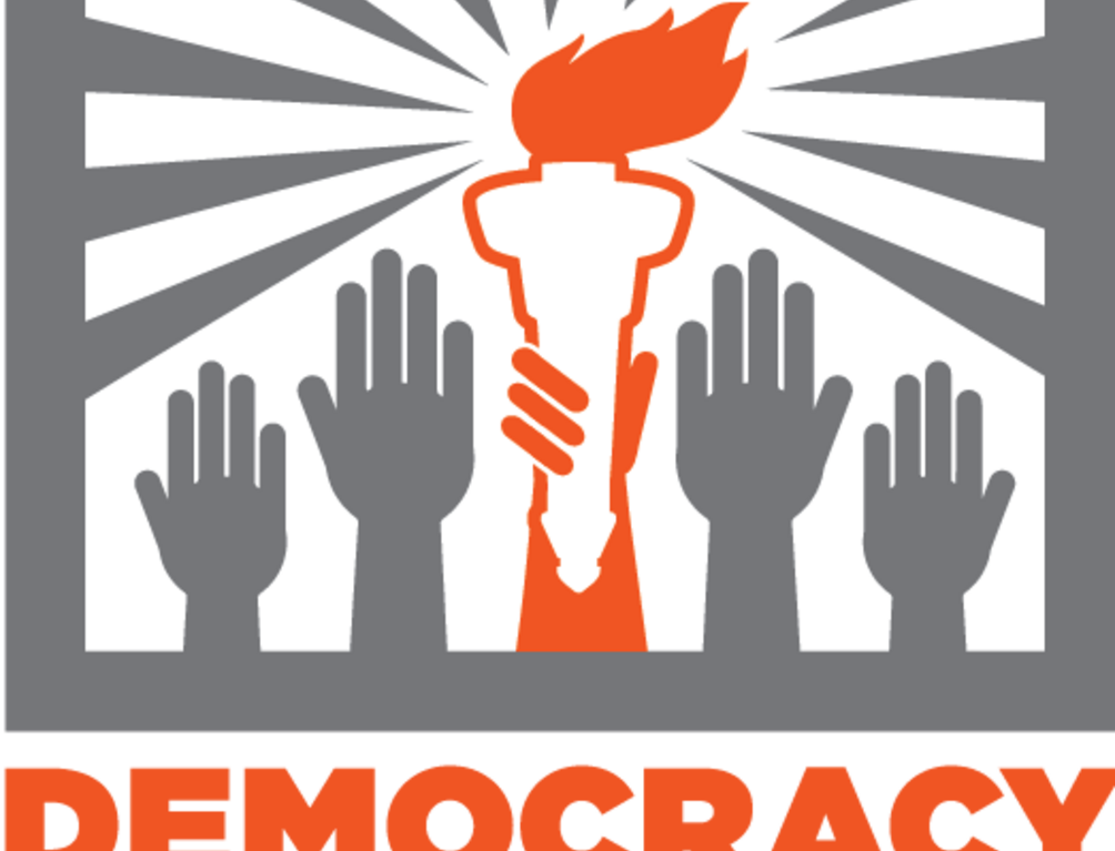 Hands reaching up towards the sky, with one in the center holding a torch, over the words "Democracy Initiative"