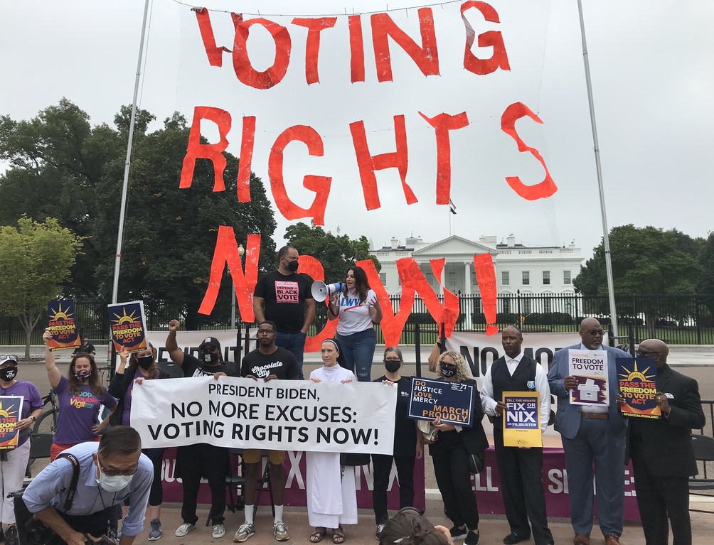 CEO Virginia Kase and fellow activists protesting in front of the White House