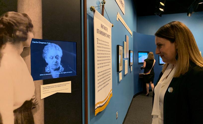 LWVUS CEO Virginia Kase watches newsreel footage of LWV founder Carrie Chapman Catt