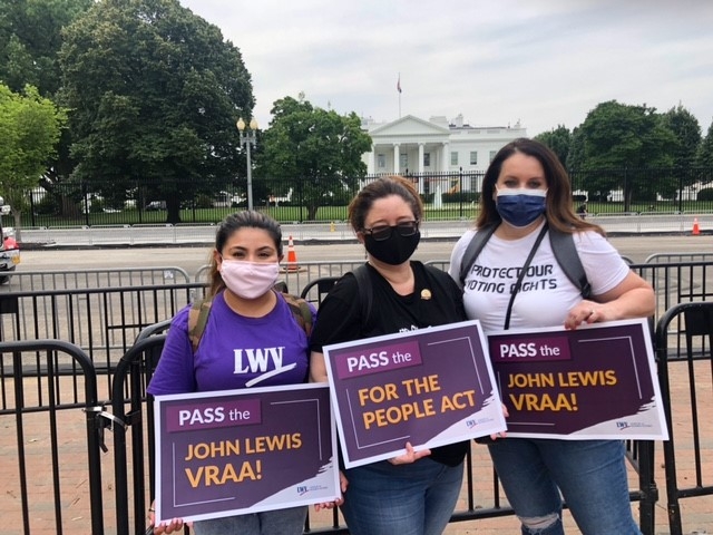 Three LWVUS employees protesting in front of the White House