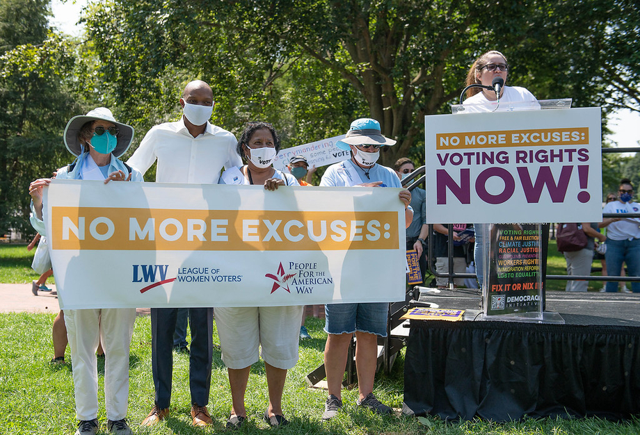 LWV members holding a voting rights banner