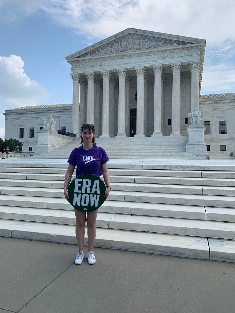 A League member holding an ERA sign in front of the US Capitol