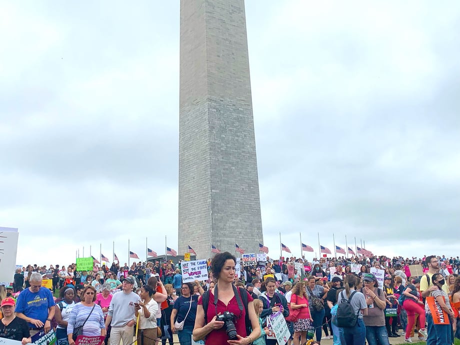 Protestors standing in front of the Washington Monument standing up for abortion rights