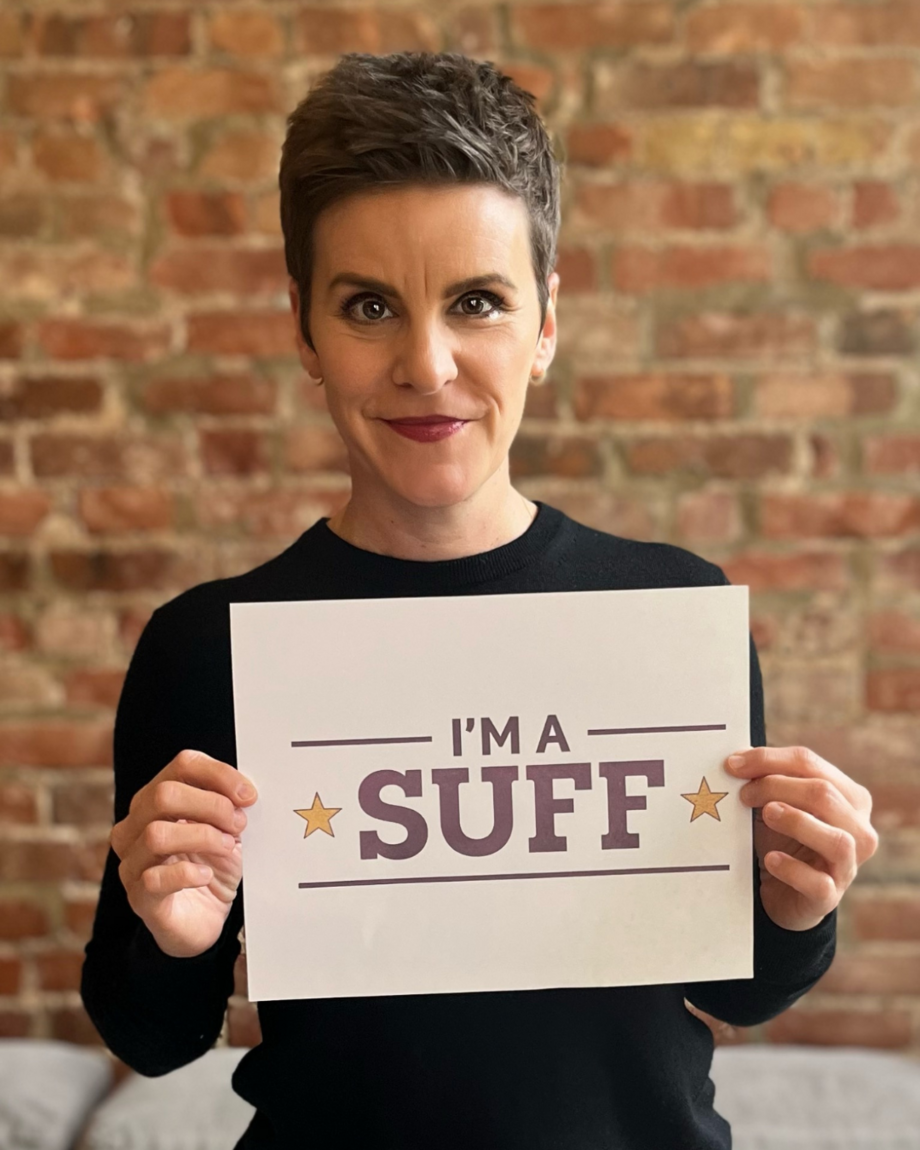 Suffs cast member Jenn Colella holding a sign that says "I'm a Suff"
