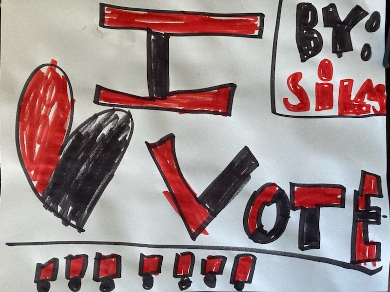 A children's drawing saying "I heart vote"