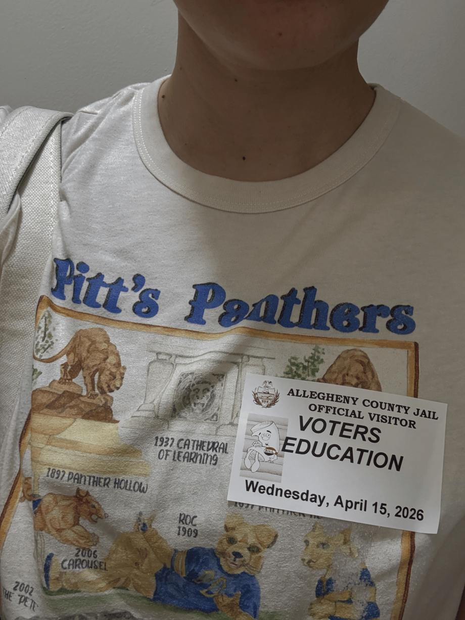 A white t-shirt that says "Pitt's Panthers"