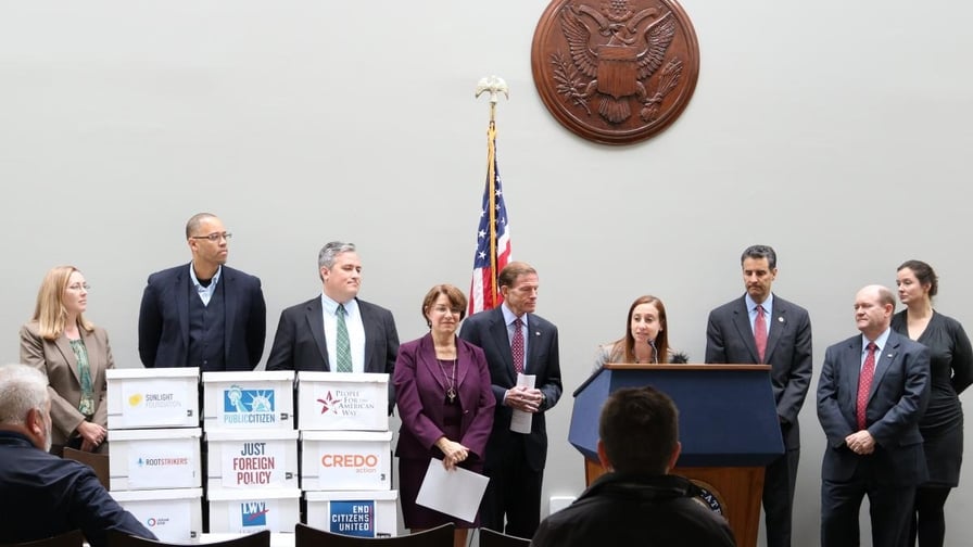 Jeanette Senecal, Senior Director of Elections, stands with  at a press conference urging the Federal Election Commission (FEC) to require online political advertisements to disclose their sources of funding.