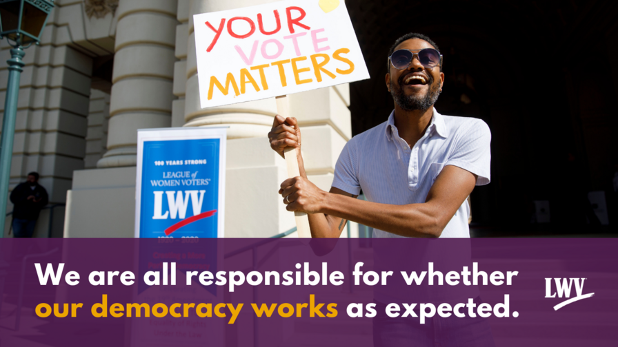 A man holding a sign that says "your vote matters" above the quote "we are all responsible for whether our democracy works as expected."