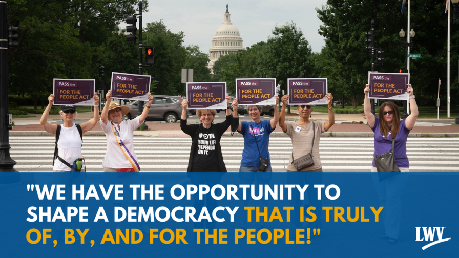 Six women holding signs in front of the US Capitol building