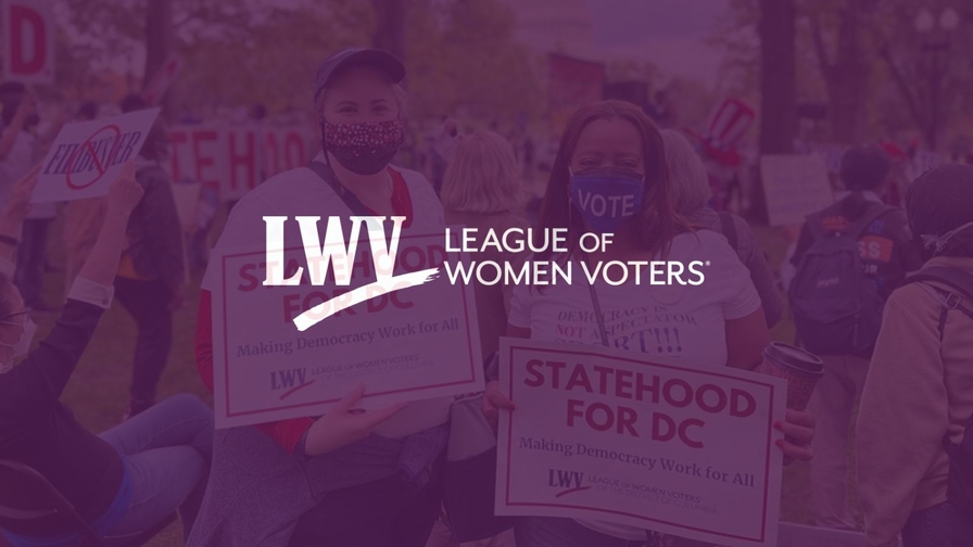 Two activists holding signs advocating for DC statehood at a rally